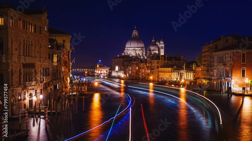 View of the gondolas of the Grand Canal on a sunny day in Venice, Italy. Night shot.