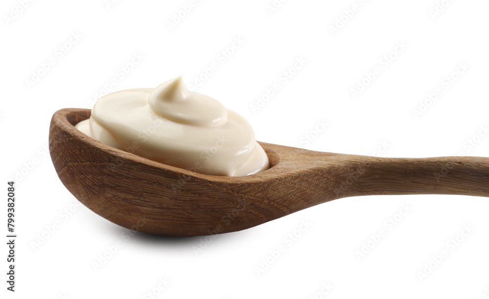Natural yogurt in wooden spoon isolated on white Natural yogurt in wooden spoon isolated on white