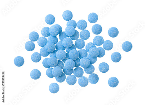 Heap of blue tablets isolated on a transparent background. Top view. Stock photo.