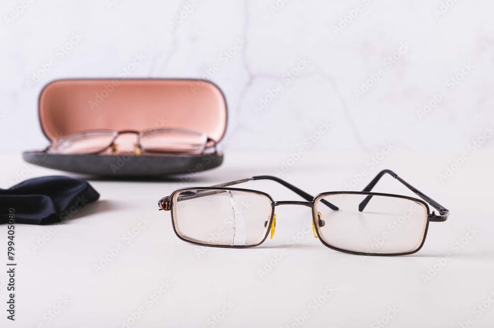 Broken glasses without hard case on the table Broken glasses without hard case on the table