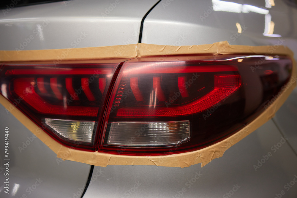 Obraz premium Transformative before and after shots of tail light repainting on a car