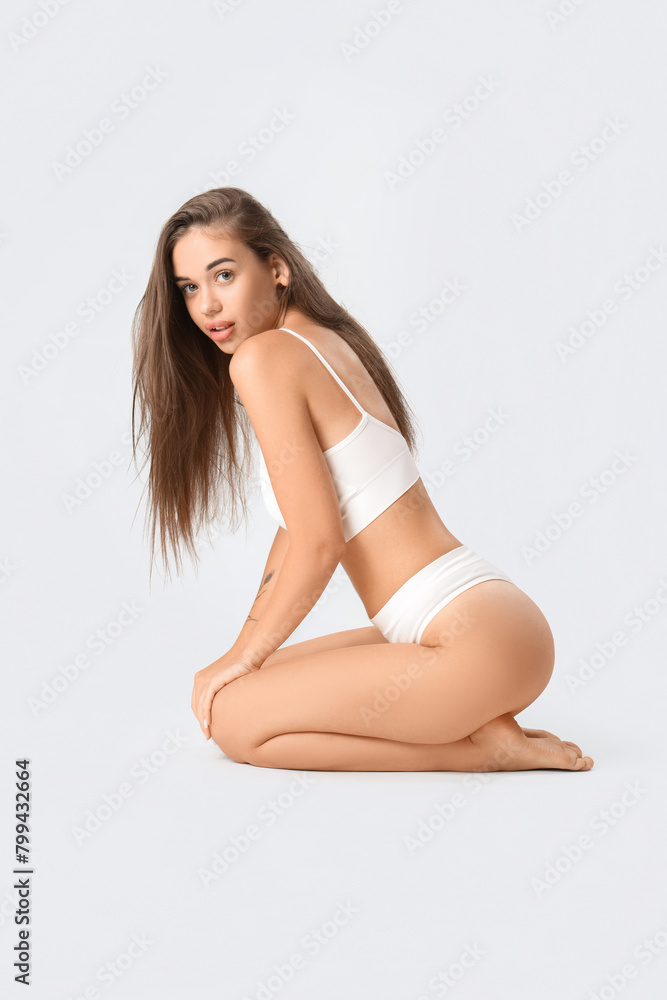 Beautiful woman in underwear on light background Beautiful woman in underwear on light background