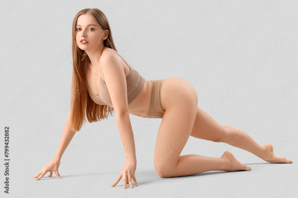 Beautiful woman in underwear on light background Beautiful woman in underwear on light background