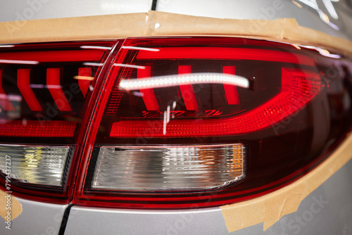 Transformative before and after shots of tail light repainting on a car © Евгений Вершинин