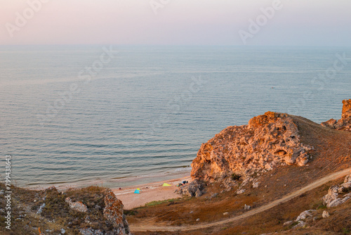 Crimean coast of the Sea of Azov, a picturesque bay with a sandy beach and a tourist camp photo