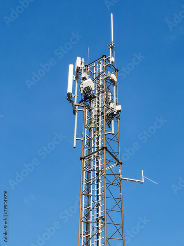 A telecommunication tower with different kinds of antennas on top