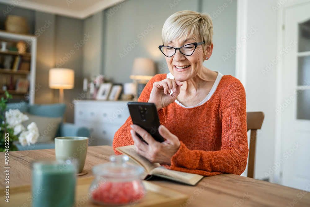 One senior blonde woman use digital tablet for video call at home One senior blonde woman use digital tablet for video call at home