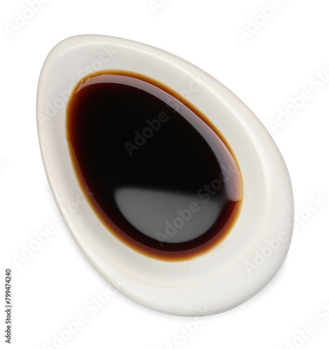 Tasty soy sauce in gravy boat isolated on white  top view