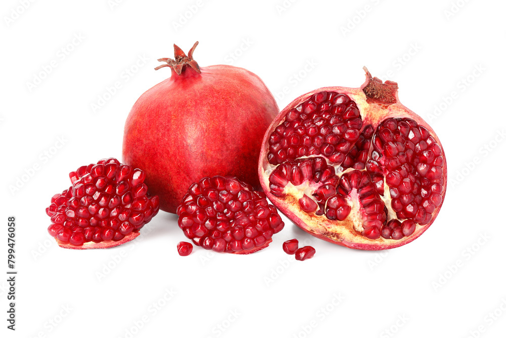 Half and whole pomegranates isolated on white Half and whole pomegranates isolated on white