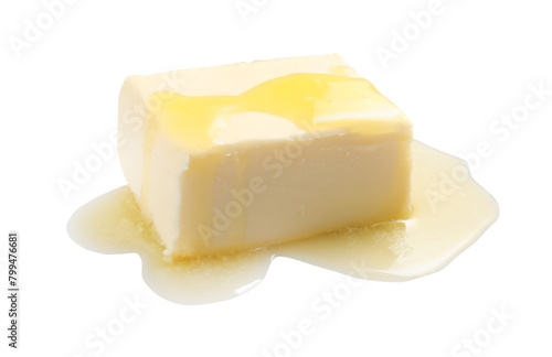 Piece of melting butter on white background