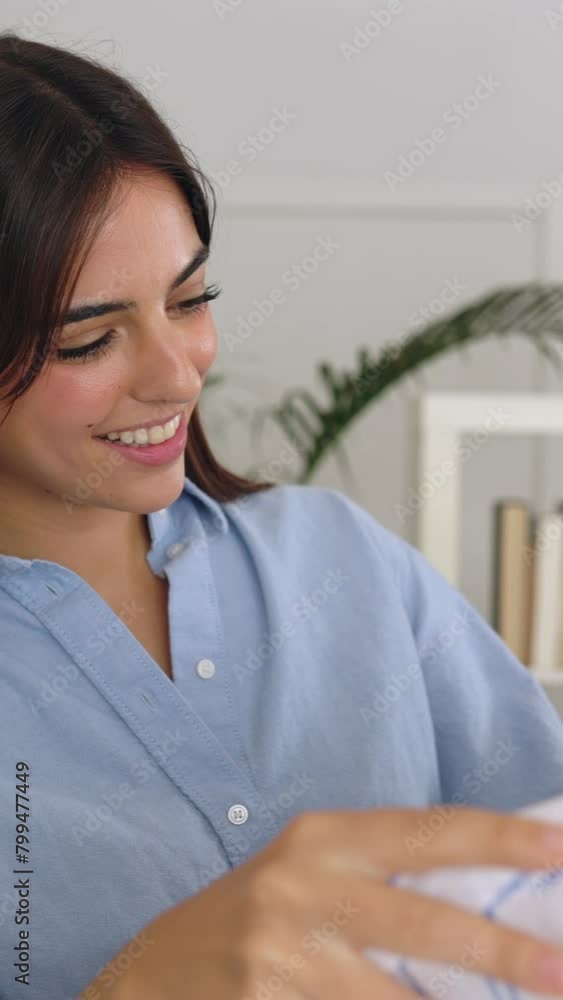Young self employed woman checking stock clothes at showroom. Female small business owner working at studio. Entrepreneur and freelancer people concept. Vertical HD footage.. Young self employed woman checking stock clothes at showroom. Female small business owner working at studio. Entrepreneur and freelancer people concept. Vertical HD footage..