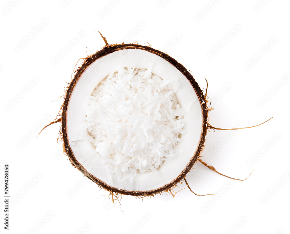 Obraz premium Coconut flakes in nut shell isolated on white, top view