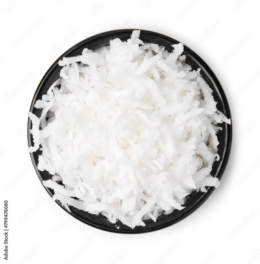 Naklejka premium Coconut flakes in bowl isolated on white, top view