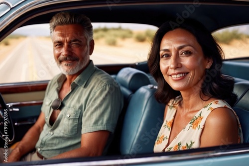 Smiling middle aged couple in car, on fun summer road trip holiday © Kheng Guan Toh