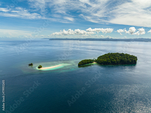 Tropical island with sandy beach and blue sea. Millari Island. Mindanao, Philippines.