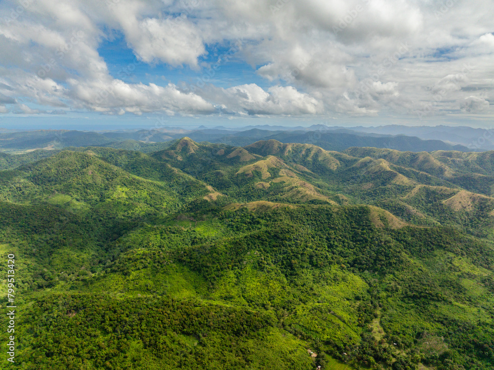 Mountains and green hills. Slopes of mountains with evergreen vegetation. Coron. Palawan, Philippines.