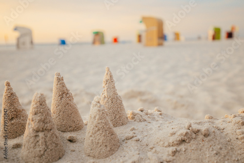 Seaside resort.White sandy beaches and Beach cabins on white sand.Beach summer mood.Vacation on the North Sea. Beaches of the Frisian Islands in Germany.Beach summer background
