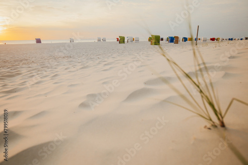Seaside resort.sandy beaches and Beach cabins on white sand.Sea vacation.Beach summer mood.Vacation on the North Sea. Beaches of the Frisian Islands in Germany.Beach summer background
