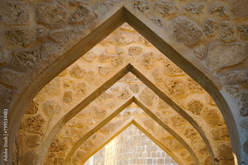 close up View of the stone archway in the ancient fortress of Qal’at Al Bahrain, a UNESCO World Heritage Site, at daytime, Manama, Bahrain  © Sergey Bogomyako