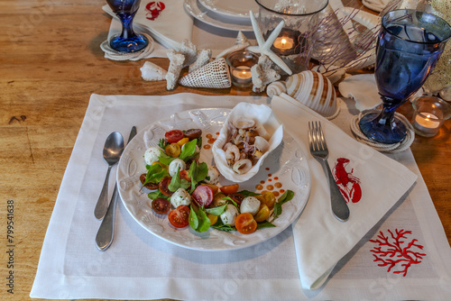 Seafood mix and Caprese salad with cherry tomatoes, mozzarella, basil, and arugula