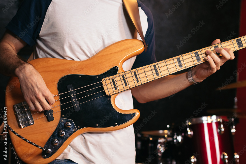 Fototapeta premium Close-up of a musician playing bass