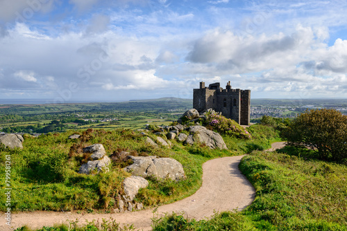 The castle on the top of Carn Brea, a hill overlooking the town of Redruth in Cornwall photo