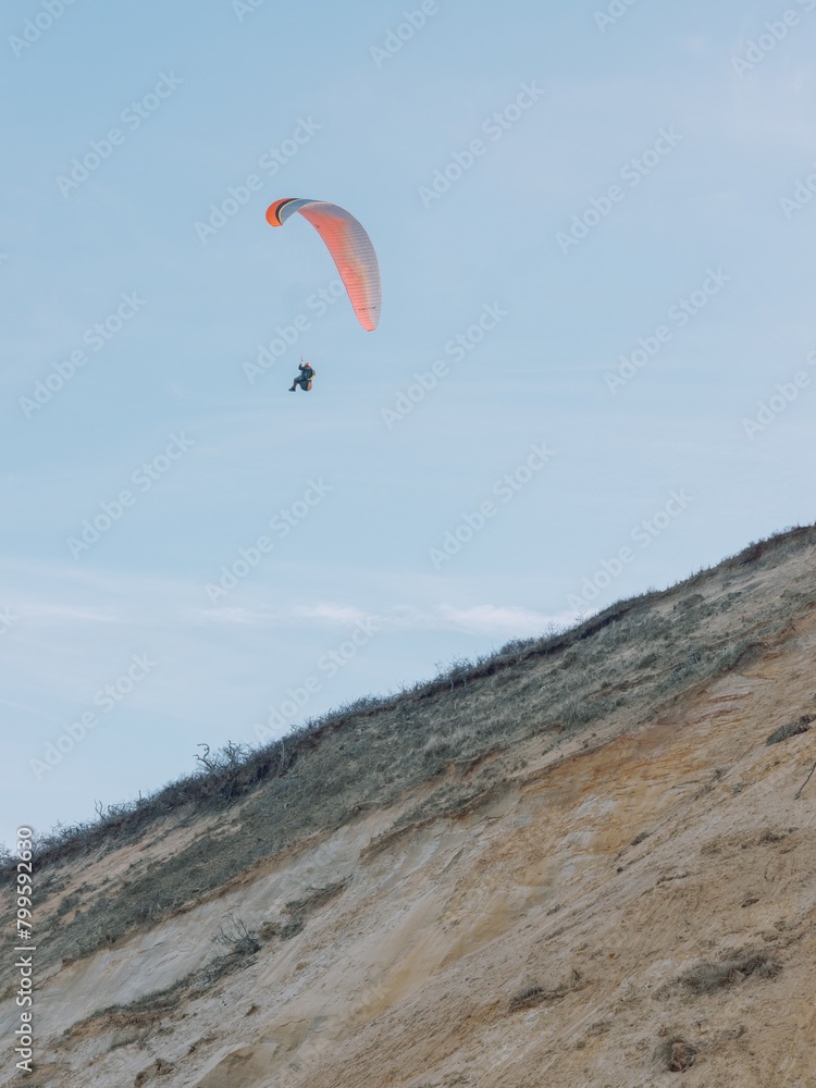 Paraglider over a Sand Dune in Cape Cod Paraglider over a Sand Dune in Cape Cod