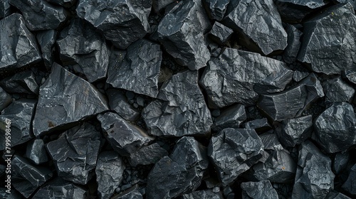 A rugged landscape of dark jagged coal chunks photo