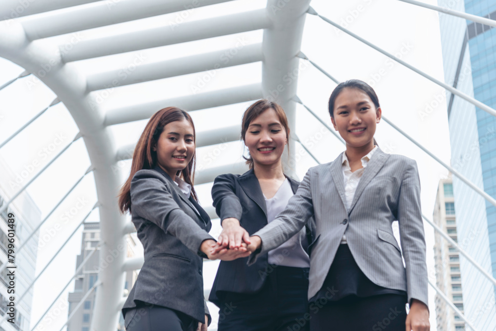 Woman Partners hands together teamwork group of business people meeting in modern city outdoor. Females Hands join empower partnership teams connection community. Mergers acquisitions partnership Woman Partners hands together teamwork group of business people meeting in modern city outdoor. Females Hands join empower partnership teams connection community. Mergers acquisitions partnership