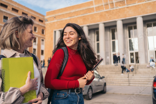 two student girls leaving class