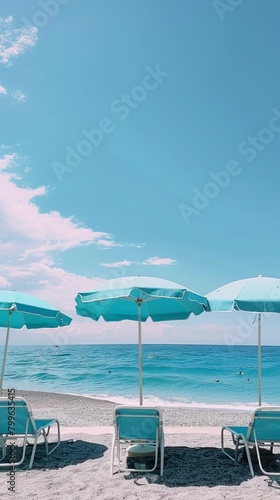 blue umbrella and sea facing chairs under Blue sky,  Summer days in beach © CREATIVE STOCK