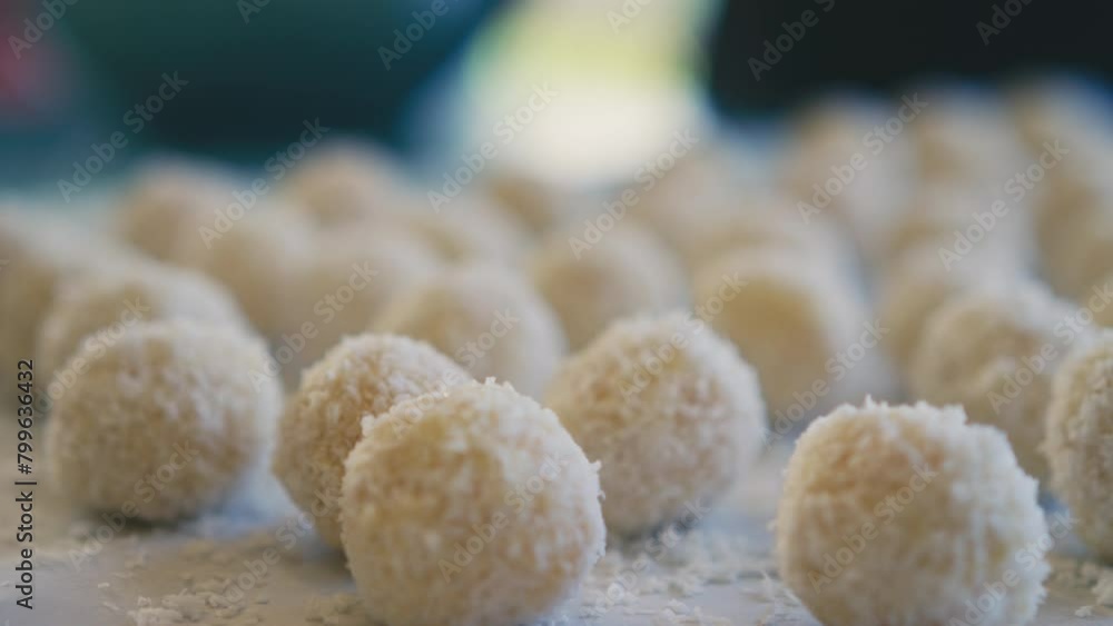 White chocolate balls covered in ground coconut White chocolate balls covered in ground coconut