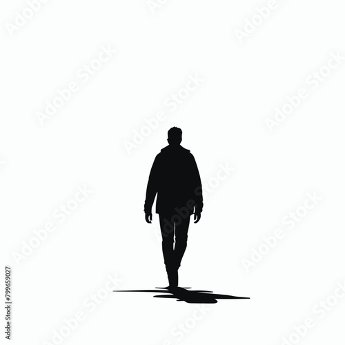 Silhouette of a person walking alone against a bright, foggy backdrop.