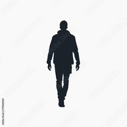 Silhouette of a man walking towards the viewer against a light background.