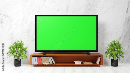 Blank green screen TV on wooden table in living room with white walls. With photocopying space, advertising design, and public relations