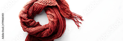 Knitted winter scarf web banner. Knitted winter scarf isolated on white background with copy space.