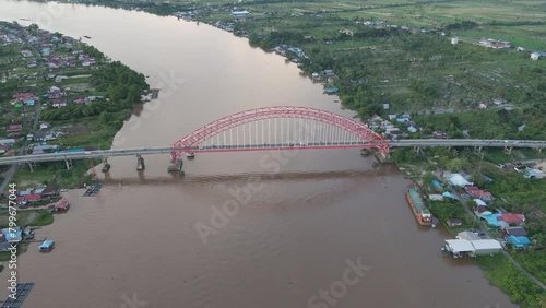 Rumpiang Bridge in the afternoon, a bridge that stretches over the Barito river, Marabahan city, Barito Kuala district, South Kalimantan photo