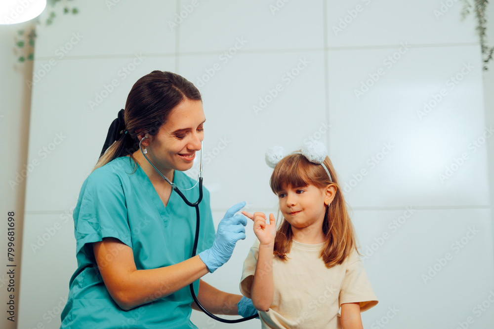 Fototapeta premium Pediatrician Bonding and Playing with her Little Patient. Gentle friendly medical worker joking with toddler kid 
