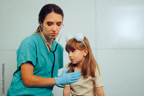 Doctor Consulting a Child Listening the Lungs with Stethoscope. Worried pulmonologist performing an auscultation examination on little patient 

 photo