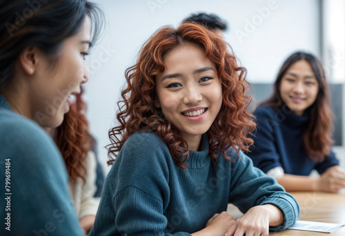 Attentive Ethnic Woman Smiles at Group