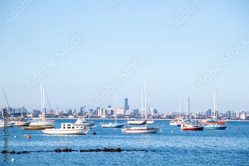 boat pier on the sea with the city in the background © Наталья Удалова