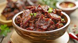 A bowl of crispy sun-dried beef pieces seasoned with aromatic spices, ready to be enjoyed as a delectable snack or crunchy topping for salads and rice dishes.