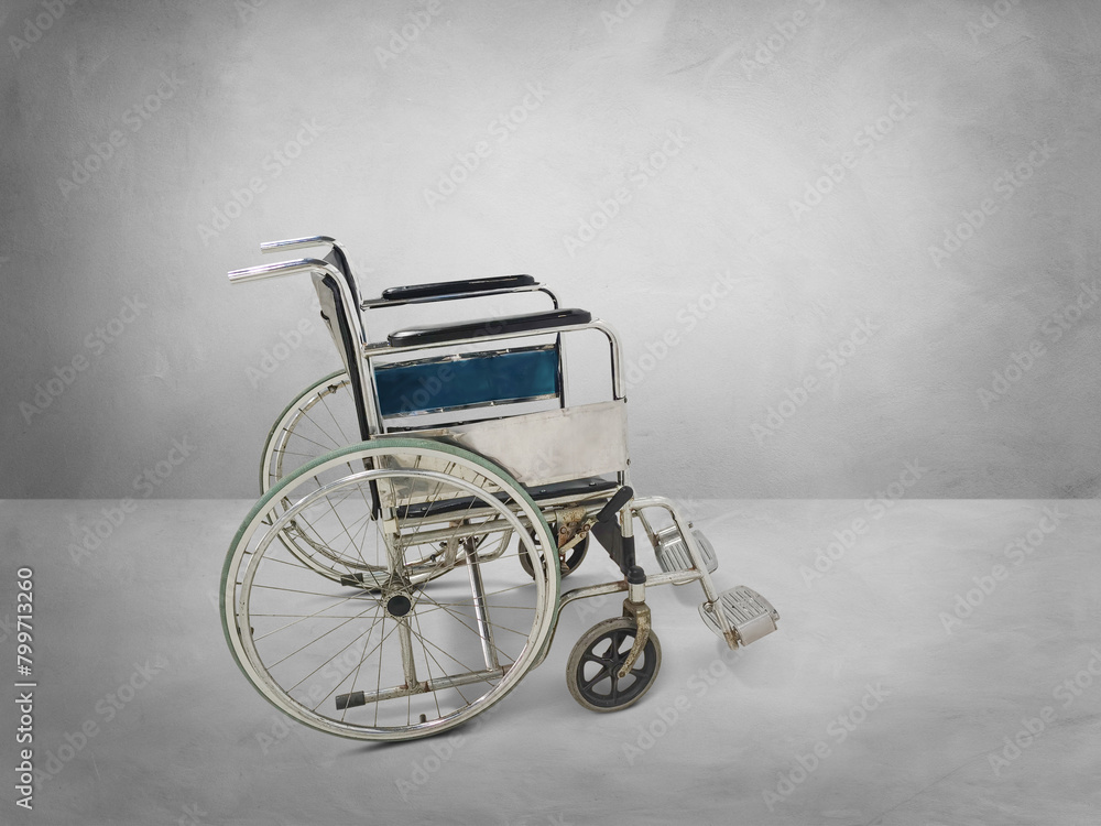 Empty wheelchair in an empty room