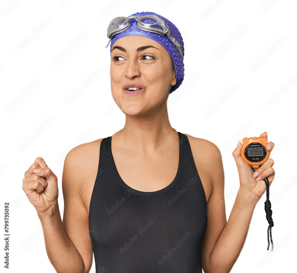 Celebrating record, young Caucasian swimmer with stopwatch Celebrating record, young Caucasian swimmer with stopwatch