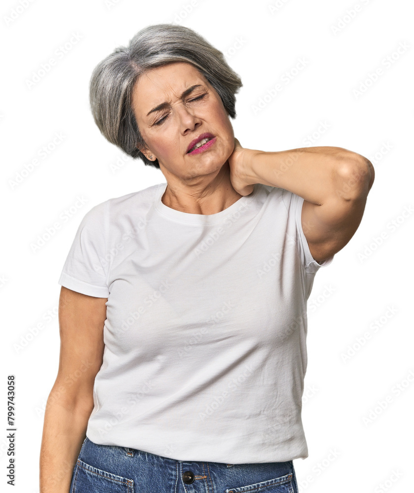 Caucasian mid-age female on studio background having a neck pain due to stress, massaging and touching it with hand. Caucasian mid-age female on studio background having a neck pain due to stress, massaging and touching it with hand.