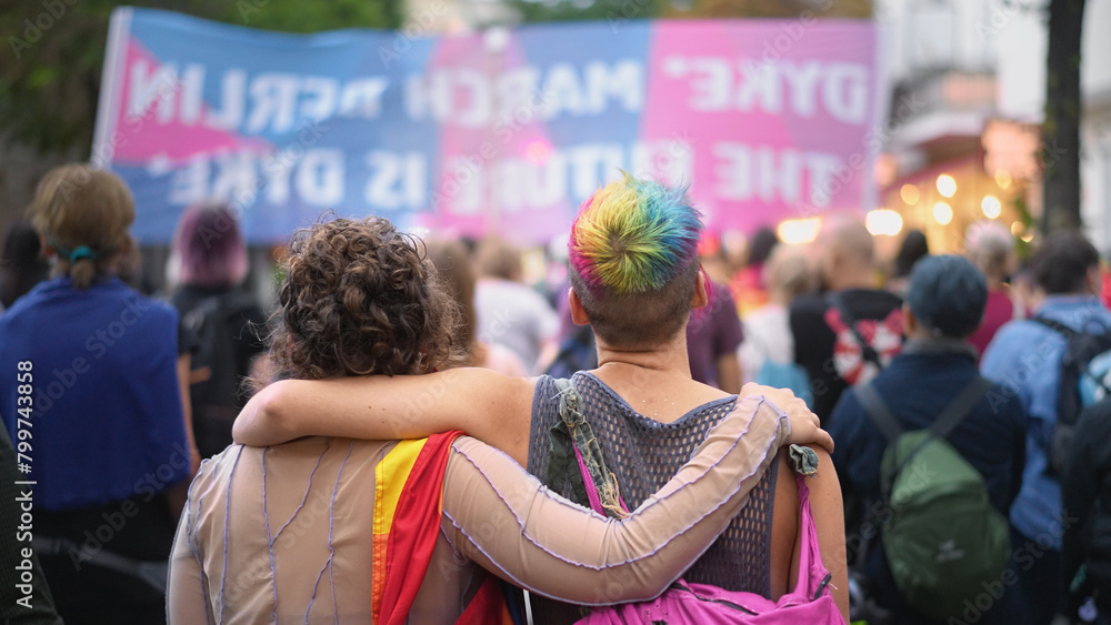 Happy lesbian couple walk lgbt pride. Two bi girl lovers go csd fest. Free same sex people coming out gay party. Dressed up love women. No stop homophobia. Queer community march. Rainbow lgbtq flag.