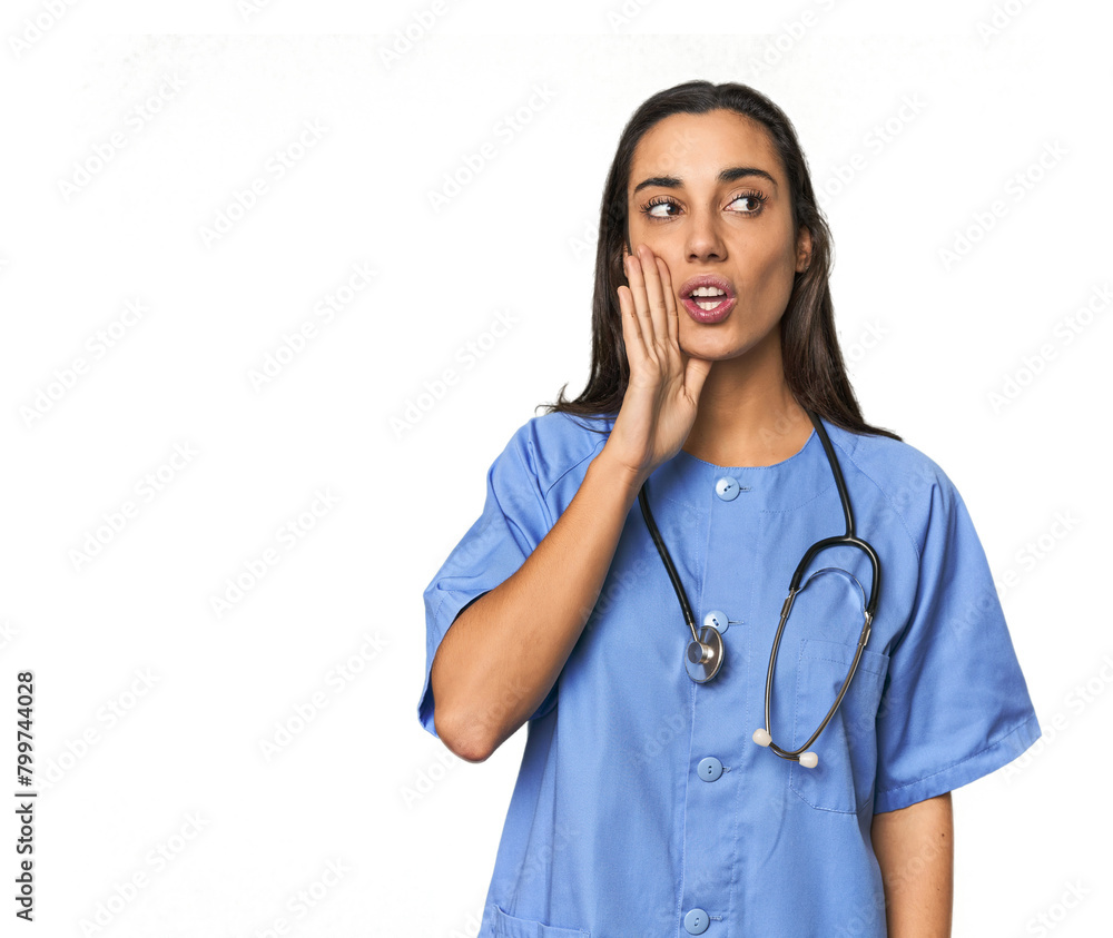 Hispanic nurse in uniform with stethoscope is saying a secret hot braking news and looking aside Hispanic nurse in uniform with stethoscope is saying a secret hot braking news and looking aside