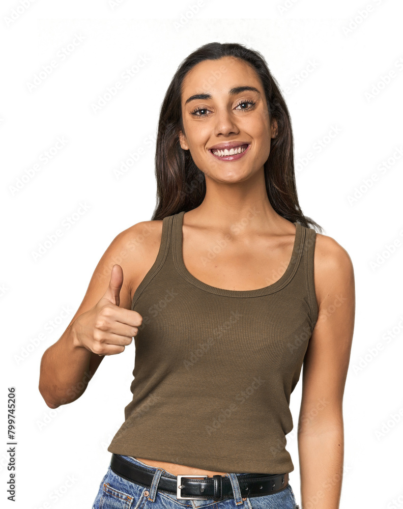 Hispanic young woman smiling and raising thumb up Hispanic young woman smiling and raising thumb up