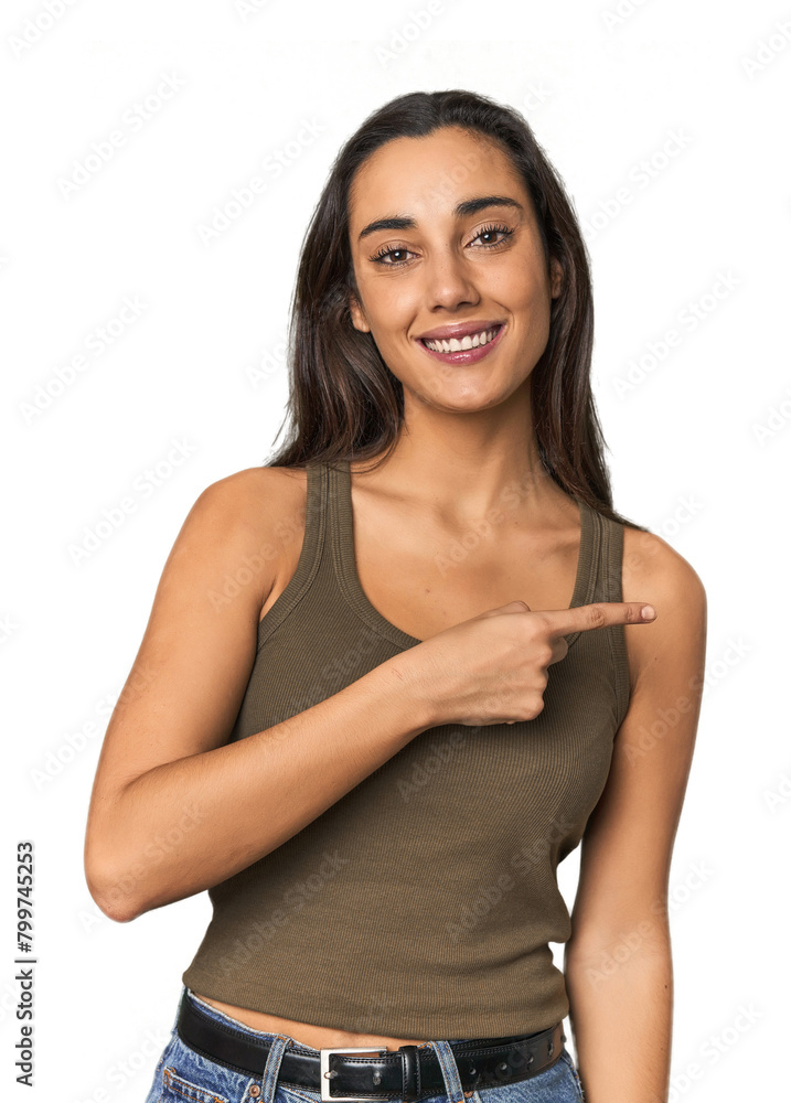 Hispanic young woman smiling and pointing aside, showing something at blank space. Hispanic young woman smiling and pointing aside, showing something at blank space.
