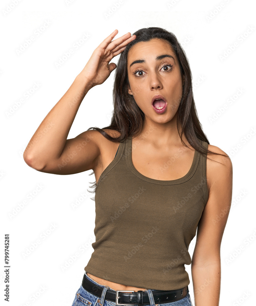 Hispanic young woman shouts loud, keeps eyes opened and hands tense. Hispanic young woman shouts loud, keeps eyes opened and hands tense.